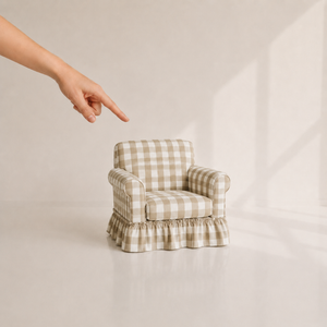 Beige gingham 1:6 miniature skirted armchair shown beside a hand for scale