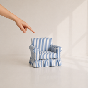 Blue striped 1:6 miniature skirted armchair shown beside a hand for scale