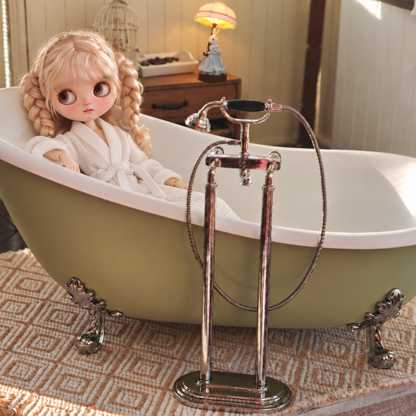 1:6 miniature green clawfoot bathtub and freestanding faucet with a 1:6 doll for scale